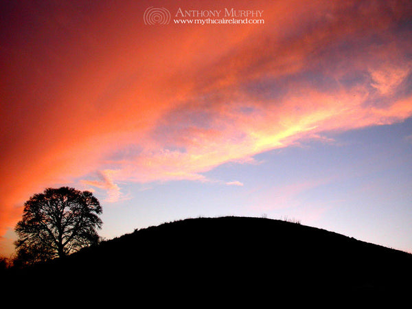 Dowth mound under a red sky