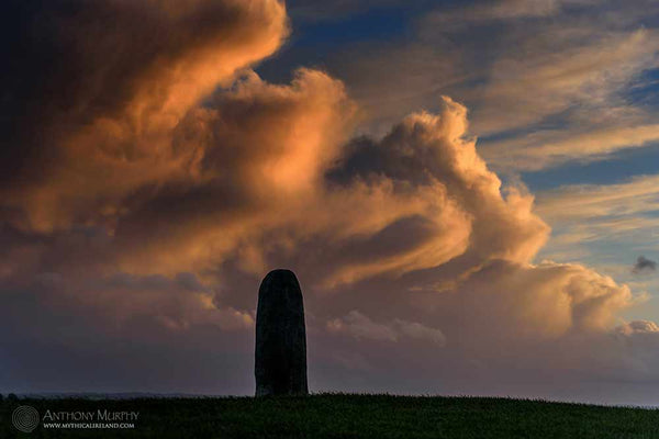 Lia Fáil and red sky at the Hill of Tara