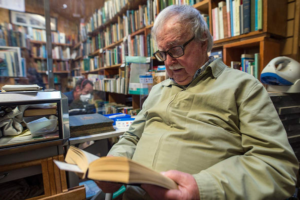 Michael Slavin reading in his bookshop at Tara