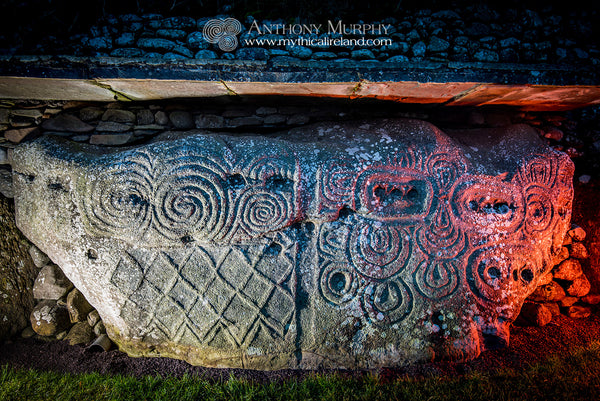 Kerb stone 52 at Newgrange lit with pale blue and red lights