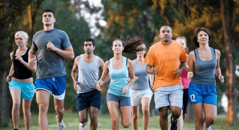 Groups of adults running outside