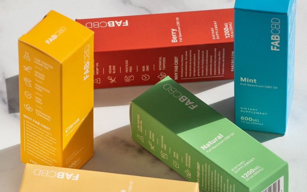 A variety of brightly colored FAB CBD boxes