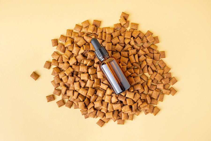 cbd oil in a pile of dog food