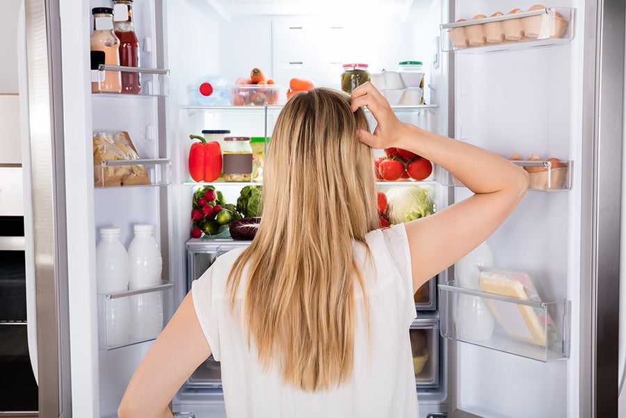 hungry woman deciding what to eat