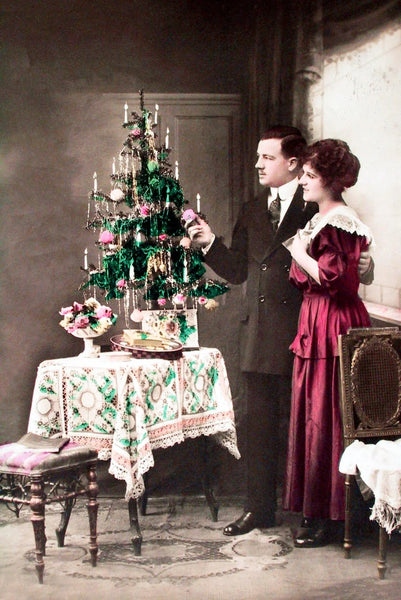 A vintage 1910 Christmas tree, couple in Berlin, Germany.