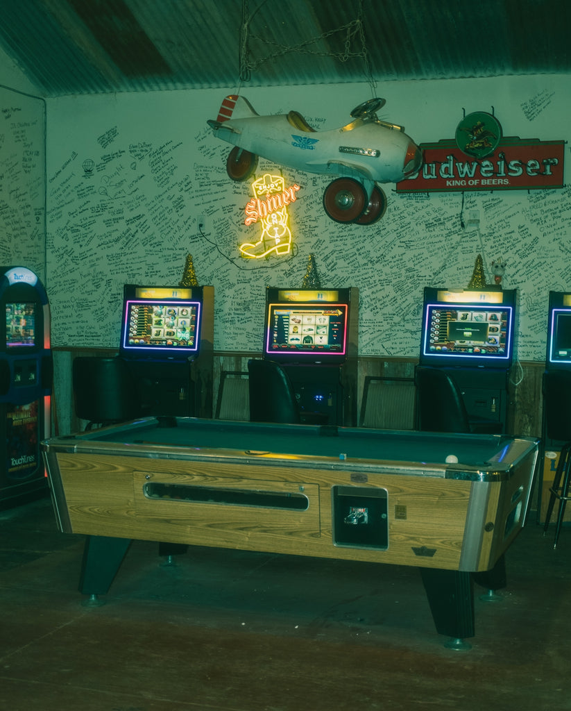 The inside decor, pool table and game machines of Paw Paw's Firehouse Cafe.