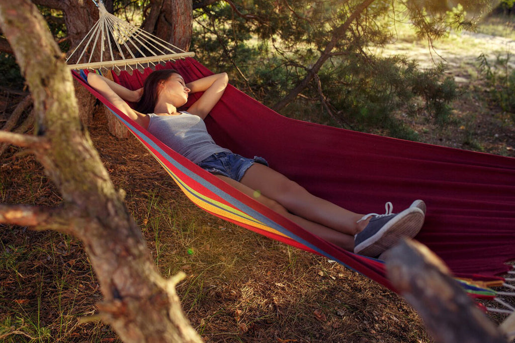 A woman lying on a hammock