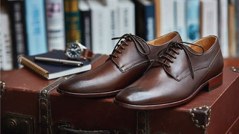 pair of brown leather shoes