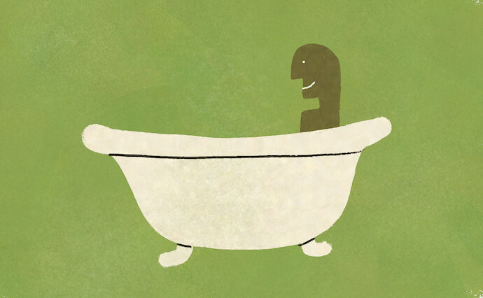 Man takes a hot bath in a bathtub