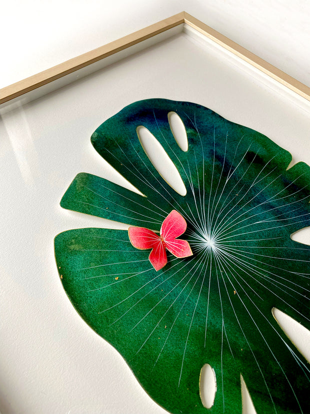 Painted cut out lily pad leaf coated in resin, dark green with subtle marbling pattern and thin white stripes. A small red butterfly rests atop the leaf.  Displayed at an angle to show sheen of resin.