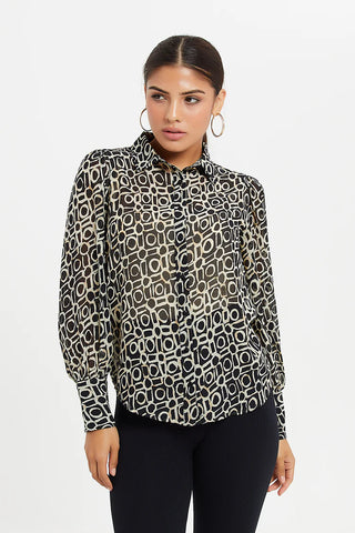 a woman wearing a blouse with a collar with animal print and a collar