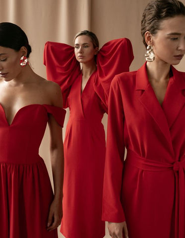 women wearing red dresses