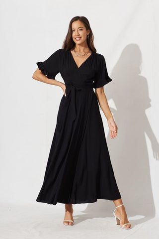 a woman wearing black dress