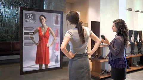 woman looking at an interactive mirror