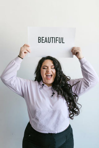 plus size women holding a Beautiful Sign