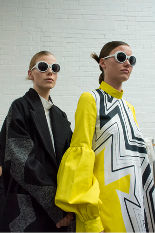 two women wearing dresses and sunglasses