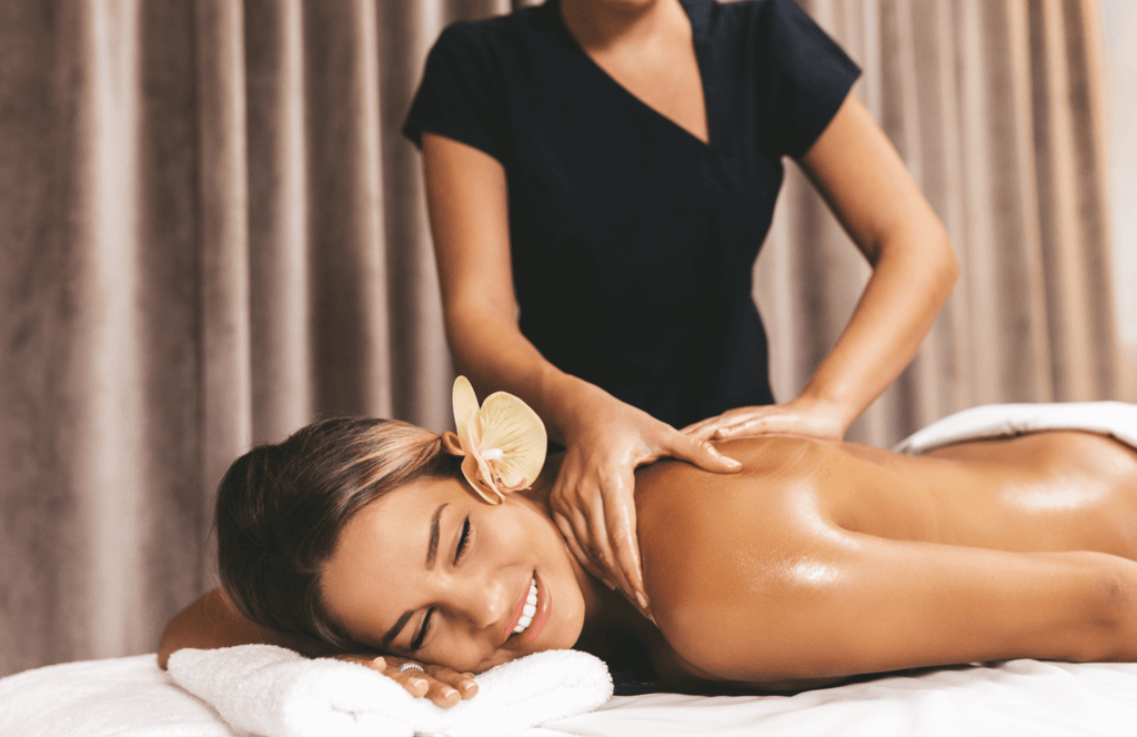 Woman receiving essential oil massage.