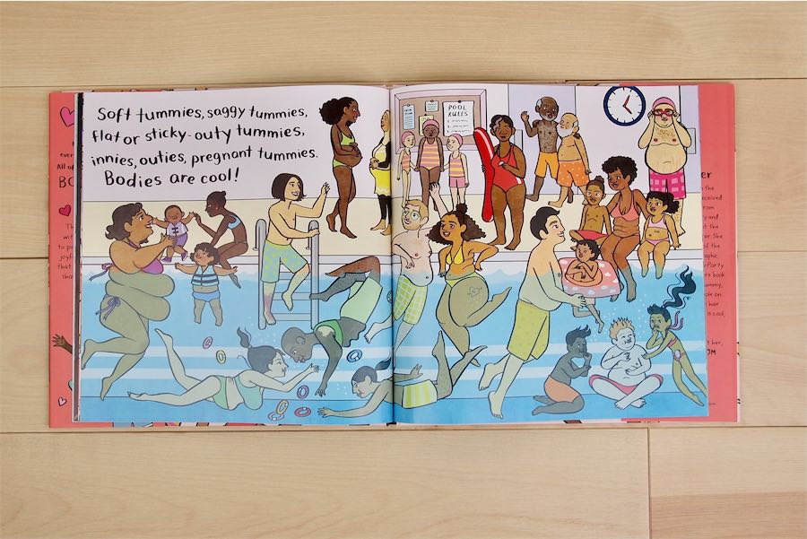 An interior spread from the book "Bodies Are Cool," showing lots of people with all different body shapes, colors, and sizes splashing and swimming in a pool