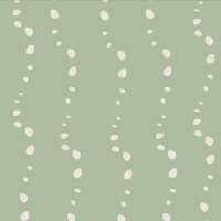 The “Sage Stones” print, available on Oolie organic cotton crib sheets, showing a soft, green background with light stones or bubbles.