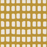 The “Picnic” print, available on Oolie organic cotton crib sheets, showing a gold-colored background with a grid of rounded rectangular natural-colored panels.