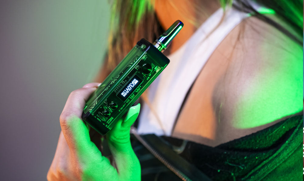 Woman holding Exxus Adapt under green studio lighting