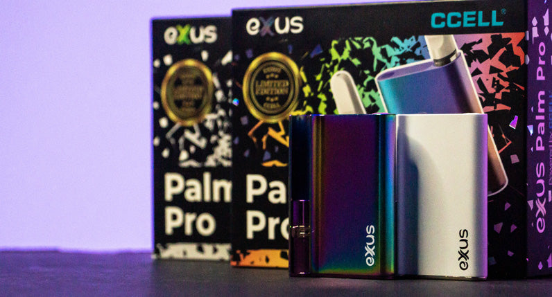 Exxus Palm Pro with packaging standing on black table with purple lighting