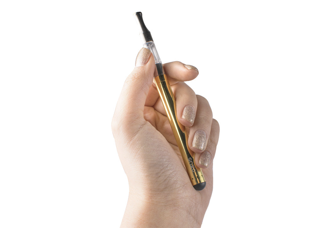 woman's hand holding the Exxus Slim Auto Draw Vaporizer on white background