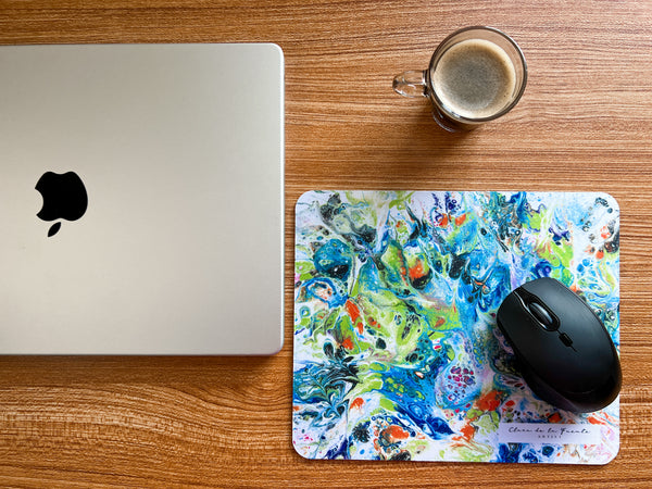 Butterflies Mousepad next to a laptop