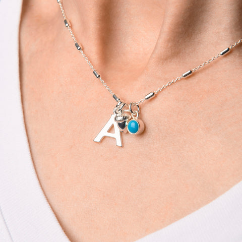 Charm necklace on neck