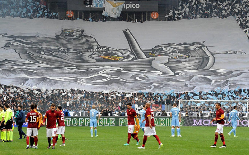 Roma & Lazio players in the ground with a huge banner in the BG