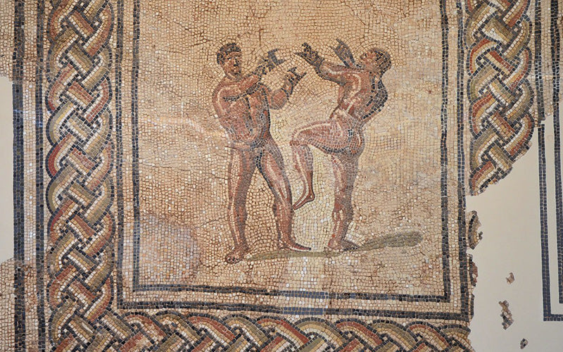 mosiac of men boxing in roman times