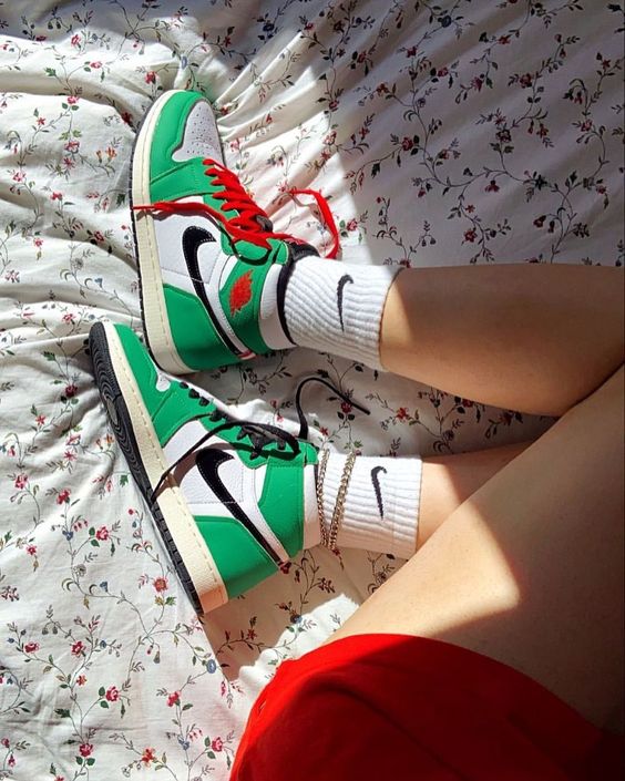 green jordans with red laces