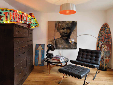Beach house interior with art canvas and surfboard