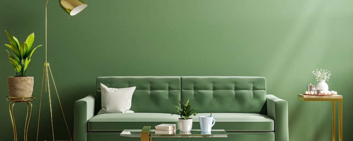 sala com sofa e planta e parede pintada de verde selvagem