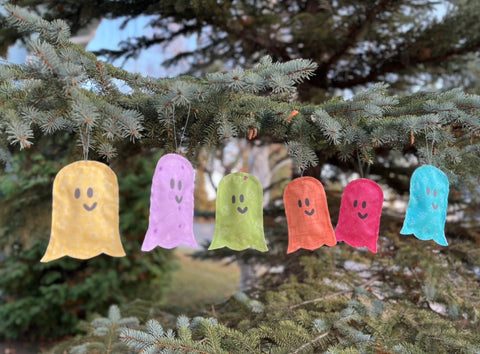 ghost ornaments in a tree