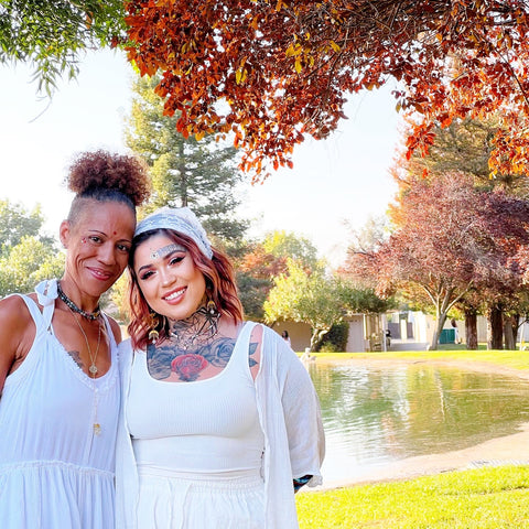 two women wearing white