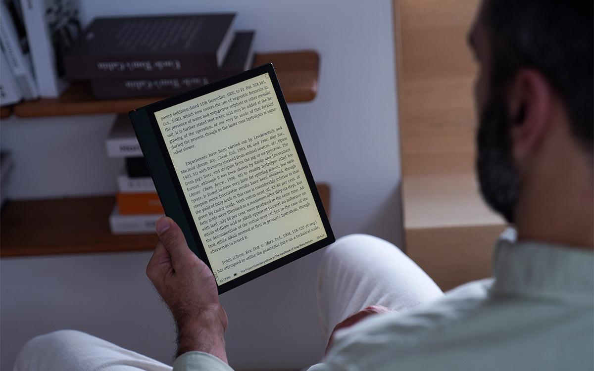 a man reading with a Note Air2 Plus