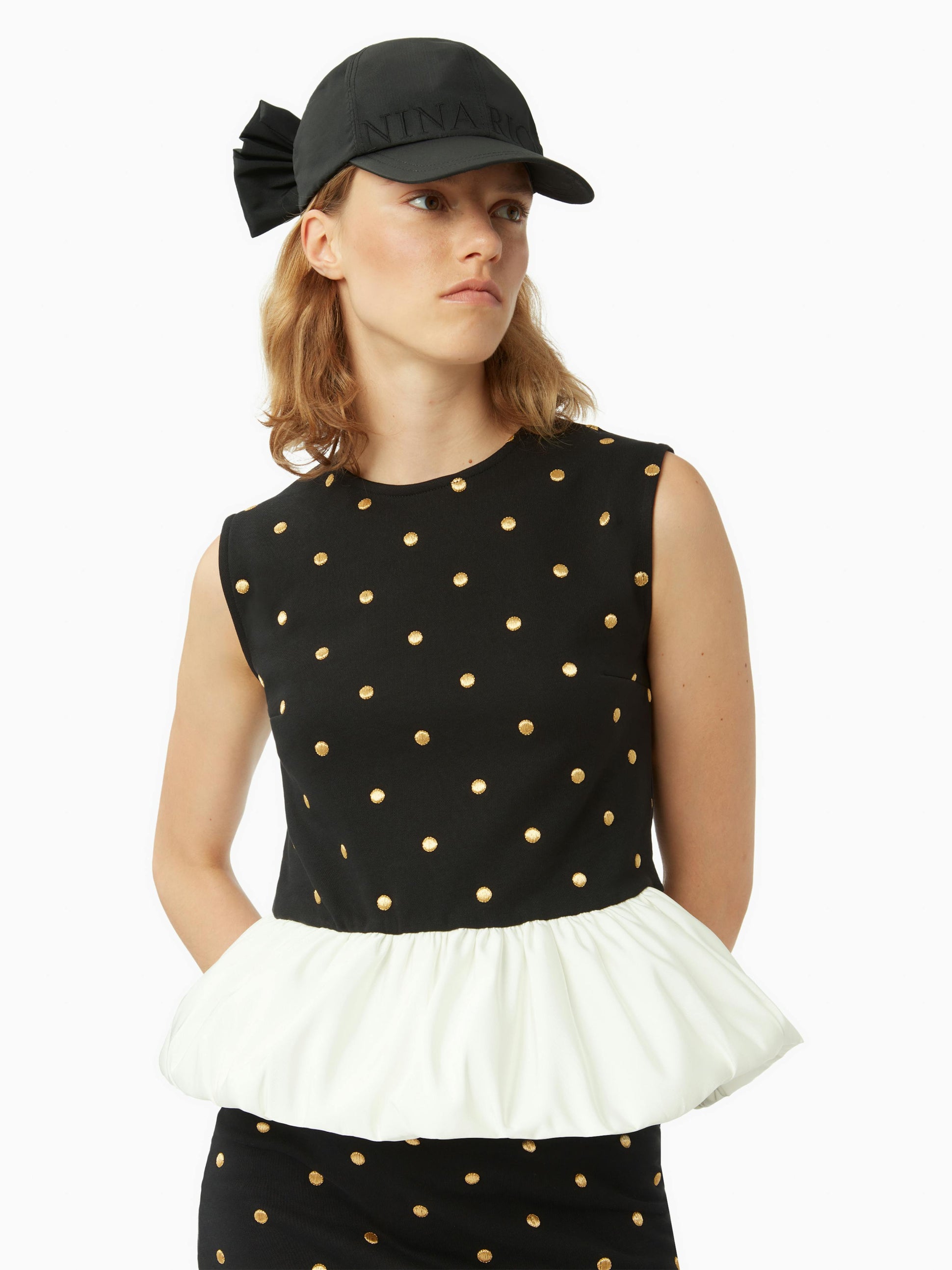 Polka dot peplum top in black - Nina Ricci