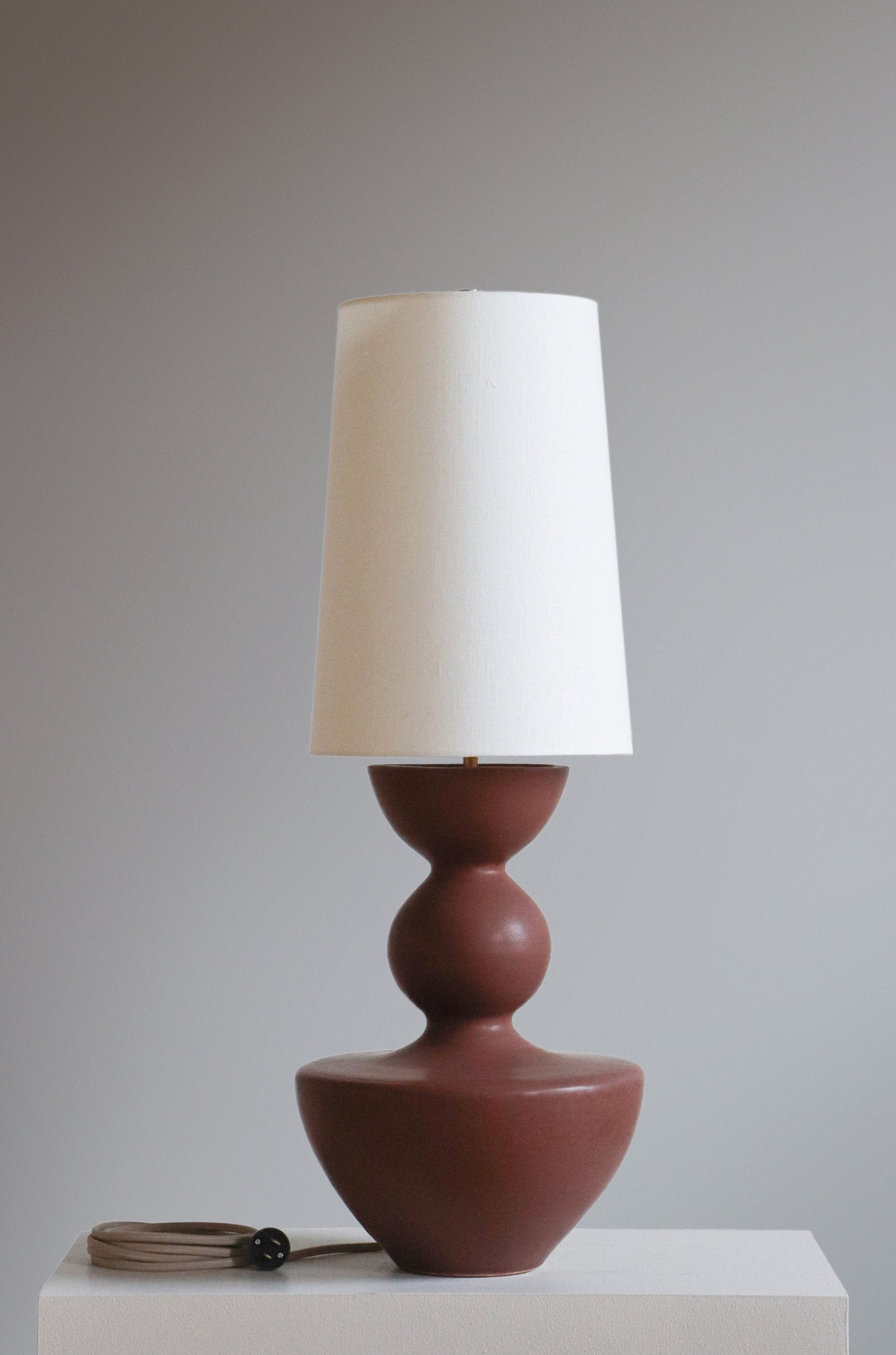 Hermena Lamp in chestnut with off white linen shade