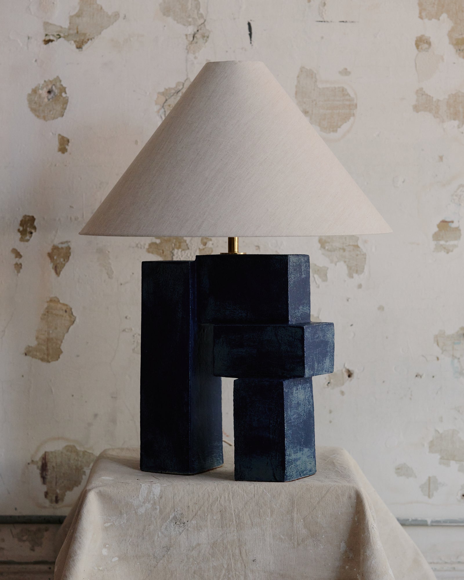 Emma Lamp shown in Lapis finish with Oatmeal Linen Shade