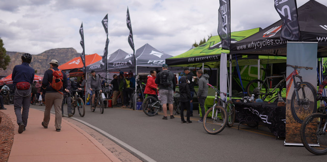 people walking around brand booths at the sedona mountain bike festival