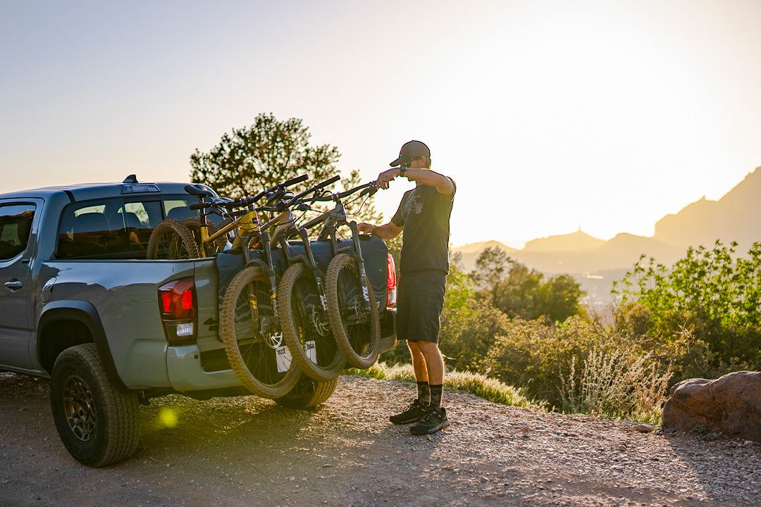 mountain biker with bike rentals in truck