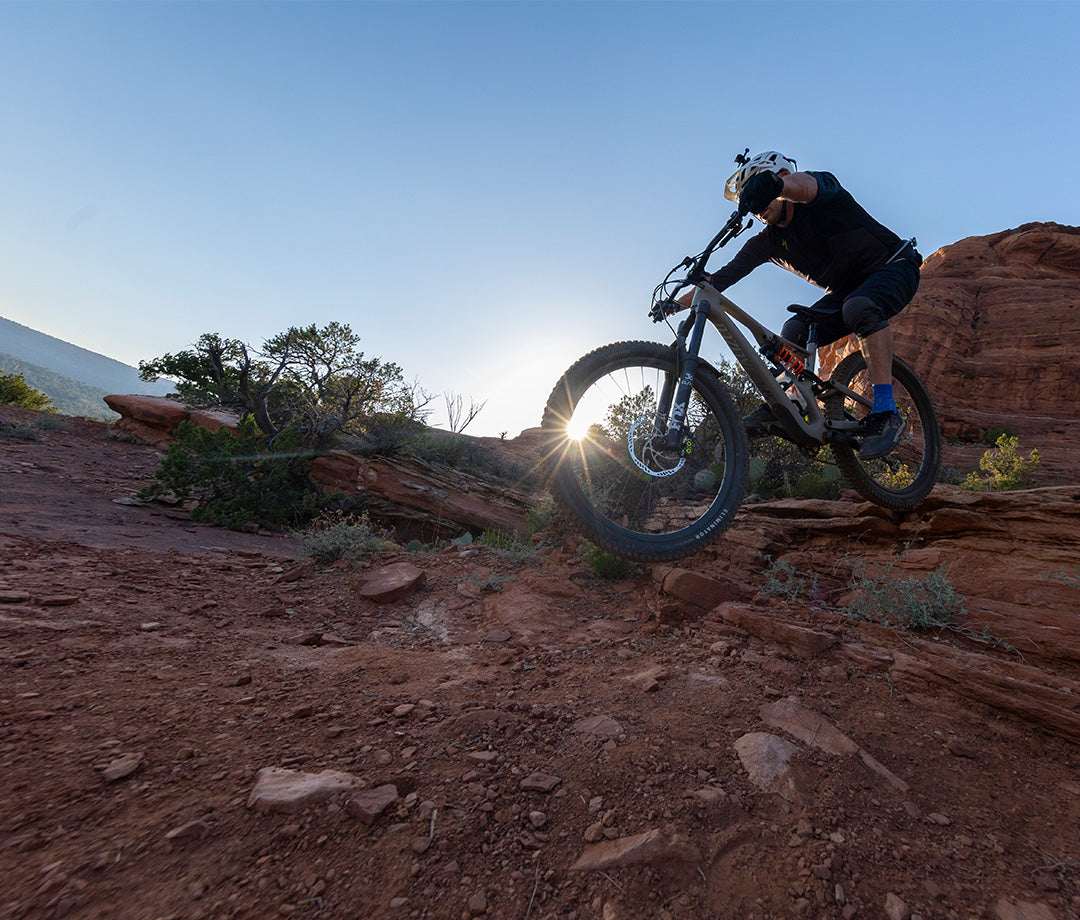 mountain biker riding in sedona arizona at sunrise