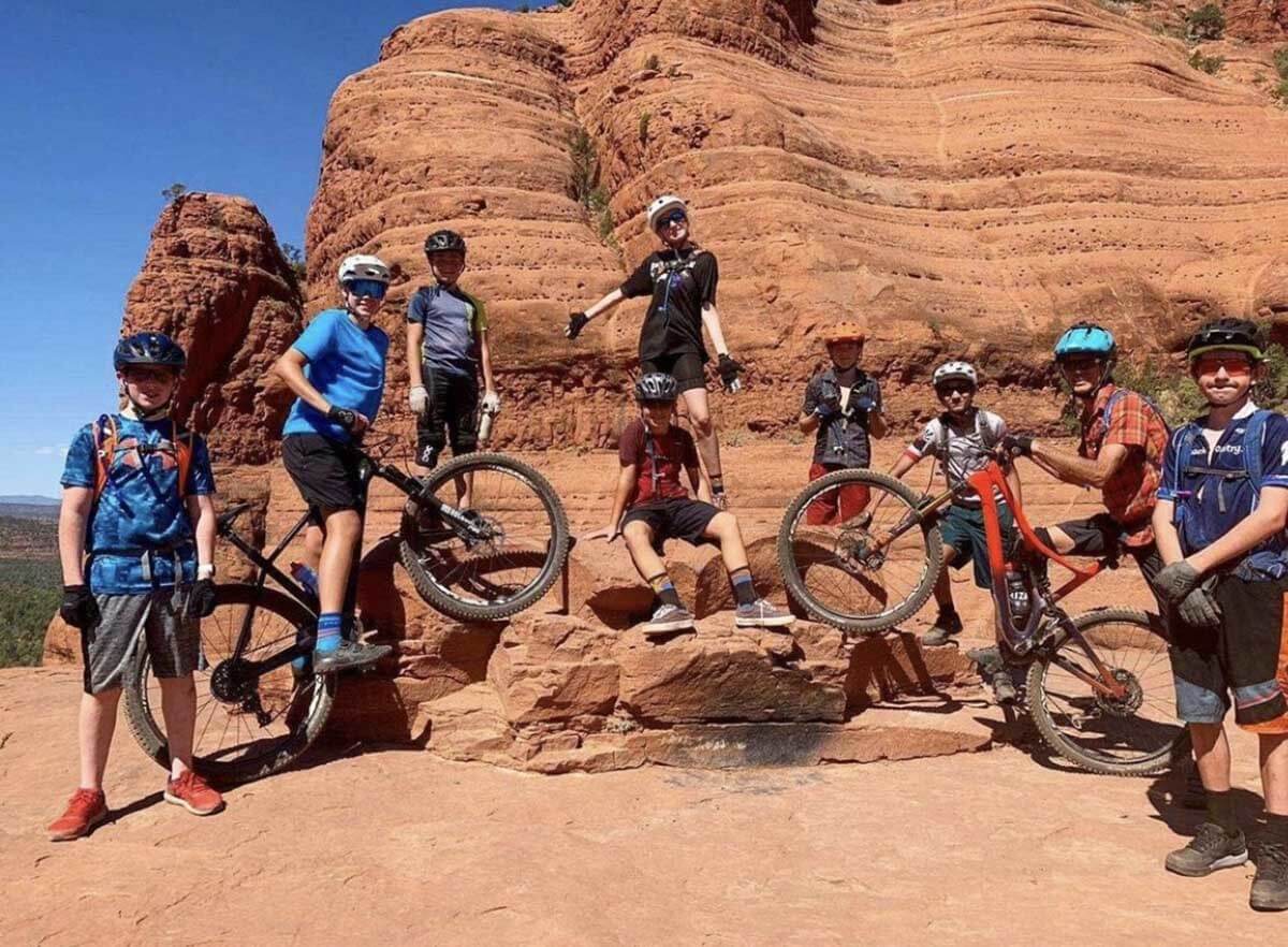 group family photo mountain biking in sedona arizona