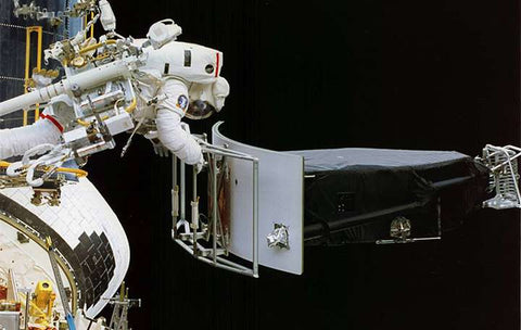 Astronaut working on Hubble telescope fix in space
