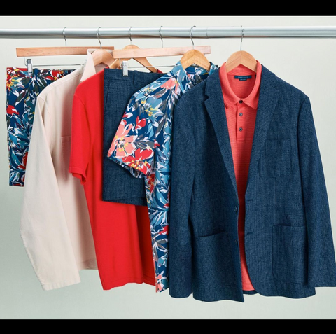 Clothing rack with a textured blazer, printed bold color tops, and shorts