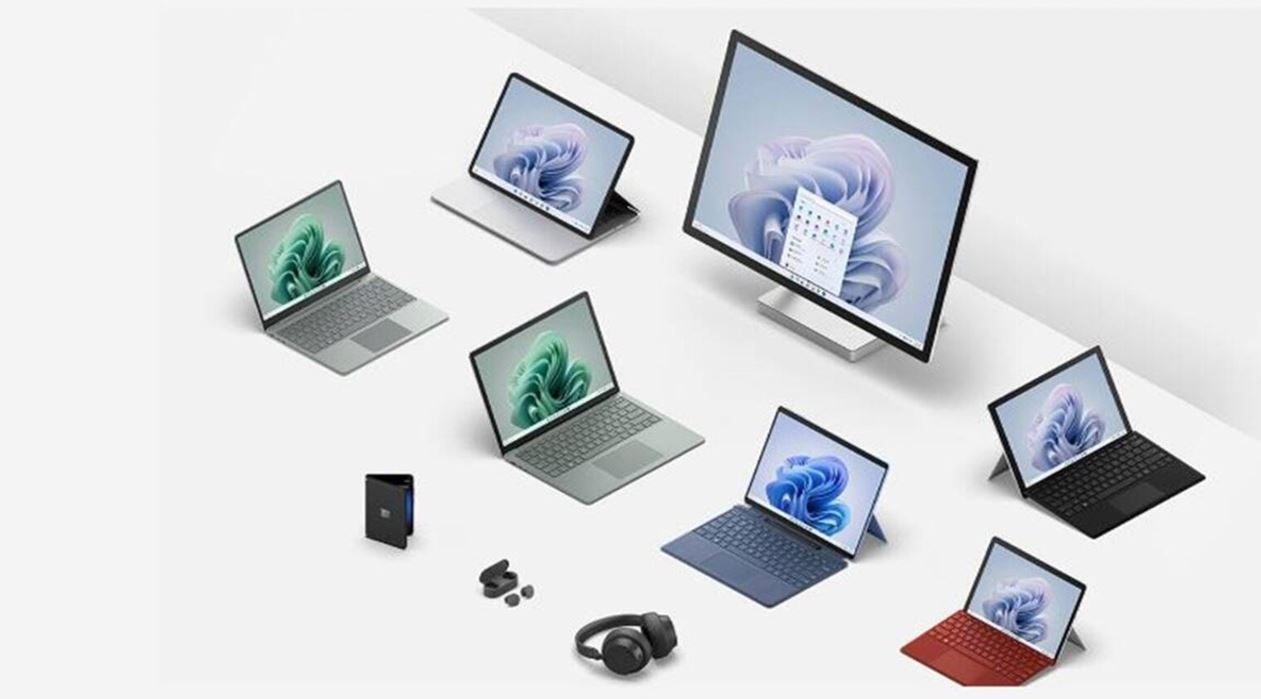 Various Microsoft Surface devices including Surface Pro 9, Surface Laptop Go, and Surface Laptop Studio