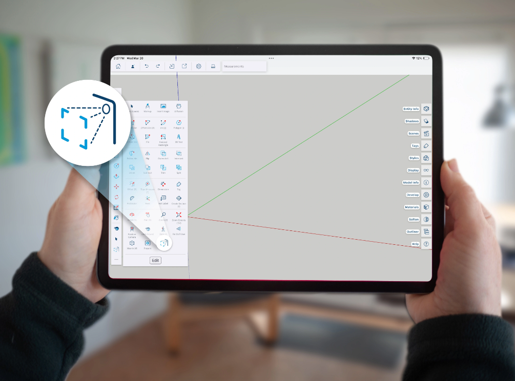 Hands holding an iPad showing SketchUp UI