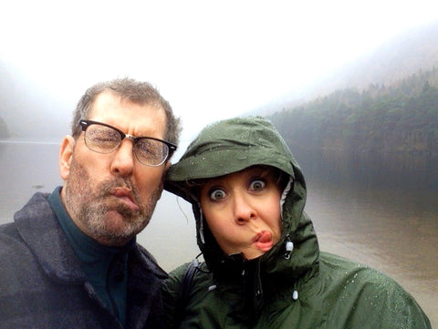 Beth and her husband making stupid faces in front of a lake in Glendalough.