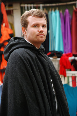 A young man with questionable facial hair looks directly at the camera.